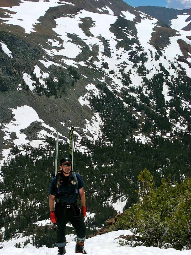 A backcountry skier climbing toward Gaylor Peak above Tioga Pass