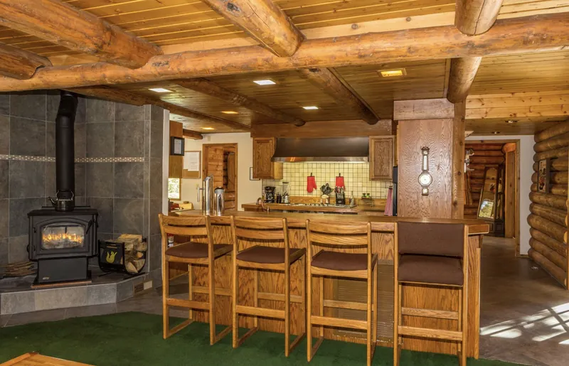 The remodeled kitchen and breakfast bar, finished in local timber